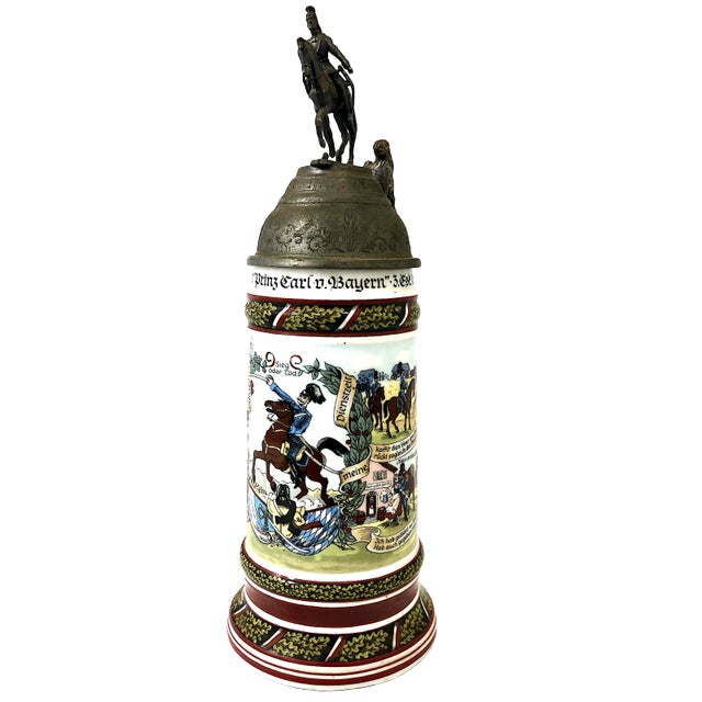 This item is a German Reservist Stein (Reservistenkrug) honoring a soldier's historical military service during the years...