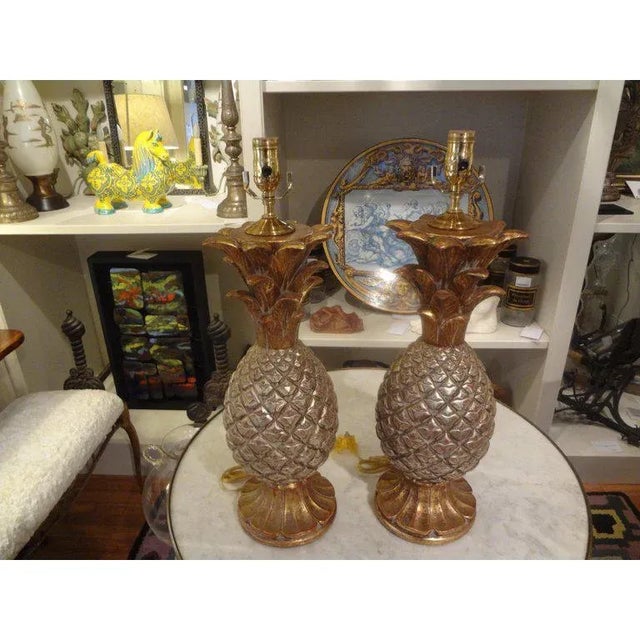 Pair Of Vintage Italian Gilt Terra Cotta Pineapple Lamps Offered is a stunning pair of Mid-Century Italian terracotta...