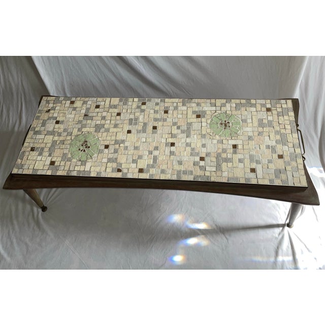 Original mid century wood with tiles on top coffee table, handles on side for easy pickup. Tiles are ivory, grey, light...