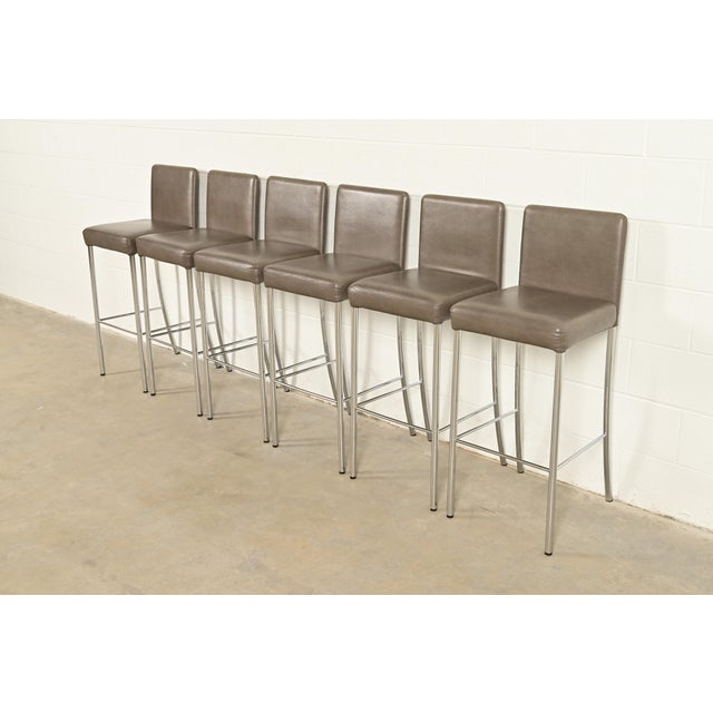 A gorgeous set of six contemporary or Modern "Switch" bar stools By Coalesse for Steelcase USA, 2010 Leather upholstered...