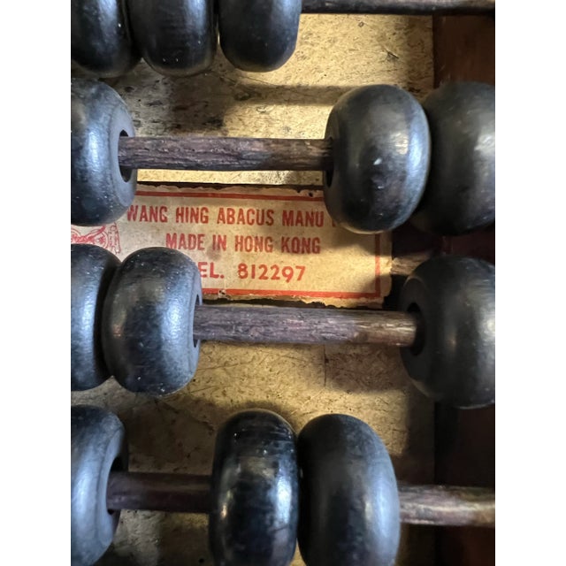 Vintage Abacus Dark wood. Sturdy frame with 13 rows and 91 beads. Original tag on back made in Hong Kong. The Abacus being...