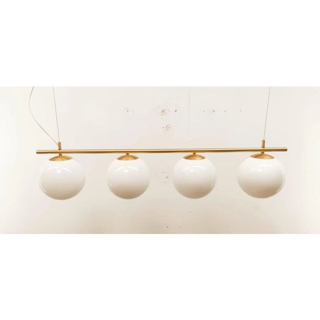 Brass Suspension with Glossy White Ball Glasses, in Restored conditions. Designed 1970 to 1979 Up to 250V (Europe/UK...