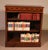 Charming small open bookcase in mahogany with English inlays. This small, uncommon model is decorated with wood marquetry...