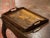 Richly carved with a lively rural scene, this antique serving tray is a charming example of French art populaire. Crafted...