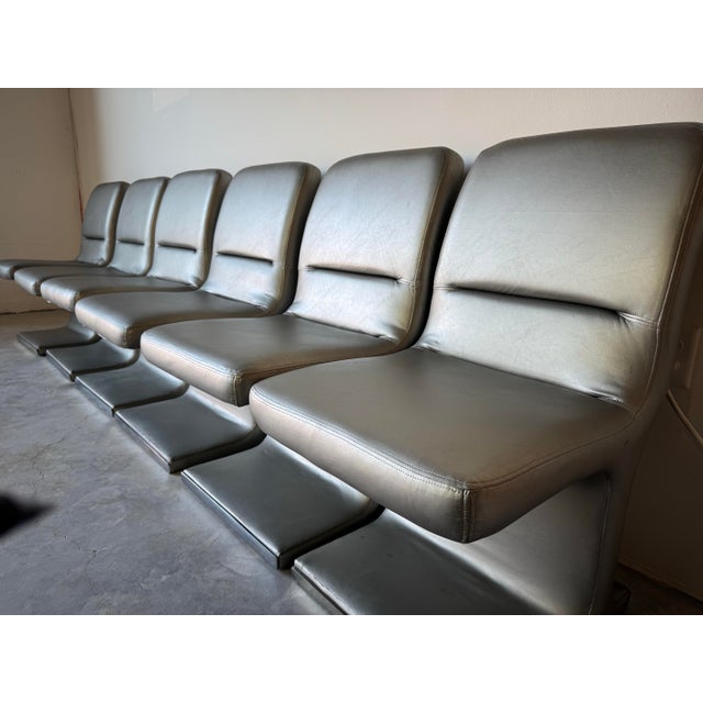 A striking set of six 1980’s Vladimir Kagan dining chairs designed for Preview, showcasing sleek Postmodern elegance....