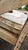 Vintage French Country Distressed Cream Painted Carved Wood Settee With Custom Toile Cushion For Sale - Image 9 of 15