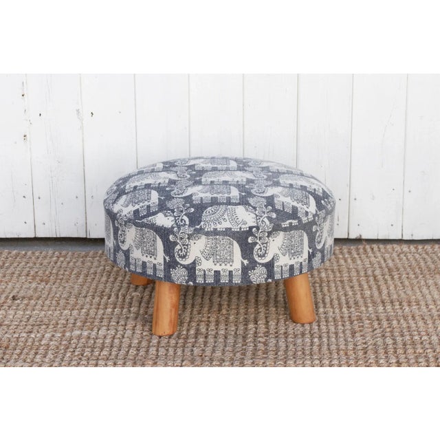 This versatile round dhurrie ottoman, feature a stunning cotton cover adorned with a splendid and fun elephant motif...