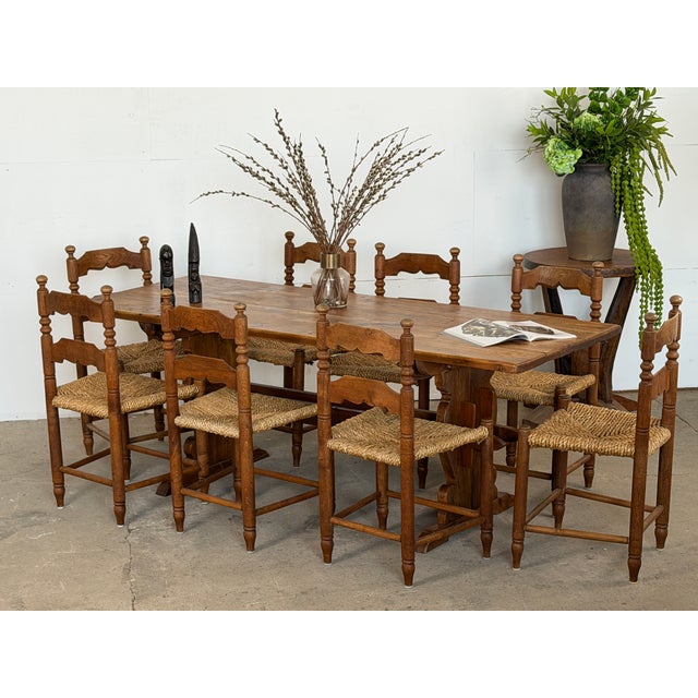 This Mid-Century trestle dining table is built in solid pine, crafted in Scandinavia during the 1940s. The top is formed...