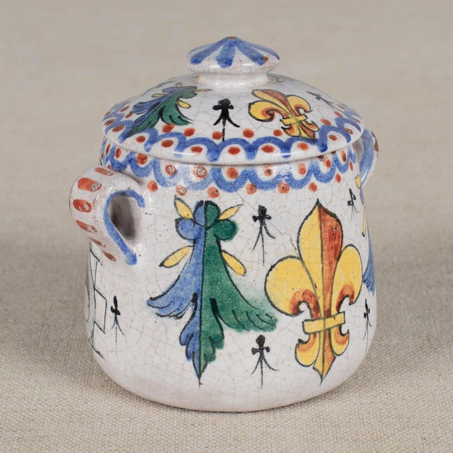 A 19th century French faience small lidded pot for mustard, honey or jam. Hand-painted in beautiful vivid colors of blue,...