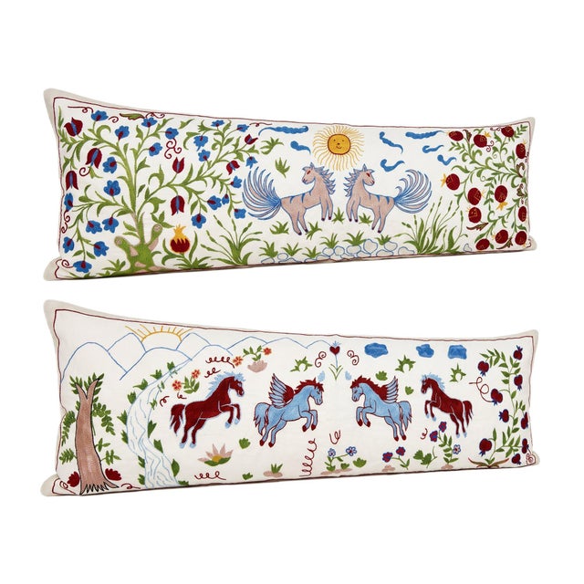 This beautiful 18'' x 54'' hand-embroidered Suzani pillow cover set was made from authentic Uzbek cotton fabric. The...