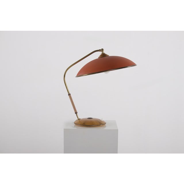 Walnut, vinyl, and brass desk lamp, Temde Leuchten edition, modernist style, 1950s. This lamp has been meticulously...