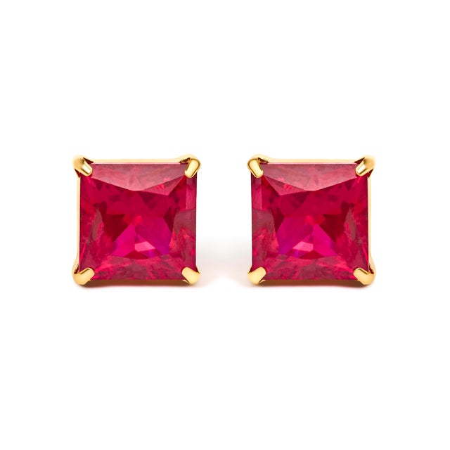 A flash of regal fire meets timeless minimalism in these luminous studs, where two 7x7 mm princess-cut red rubies glow...