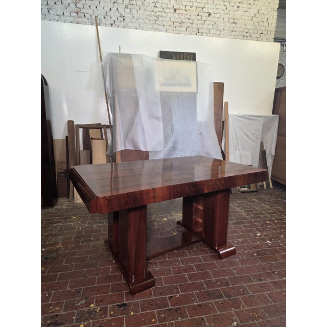 A beautiful Art Deco dining table dating from the 1920s–1930s, crafted entirely from walnut. Its particularly elegant and...
