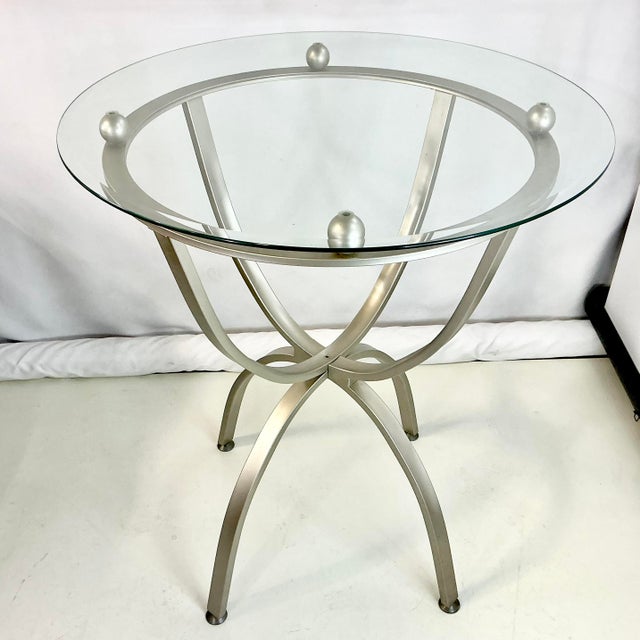This is a wonderful Aluminum Base tall barstool-height Dining Table for four. It features a silver colored metal base with...