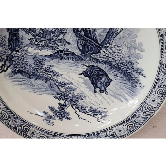 It is marked ''Made For Royal Sphinx - By Boch - Holland - Delfts''. Animated hunting scene with a wild boar in the...