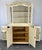 This Vintage French display cabinet presents an elegant shabby chic appearance with a soft painted finish, glazed upper...