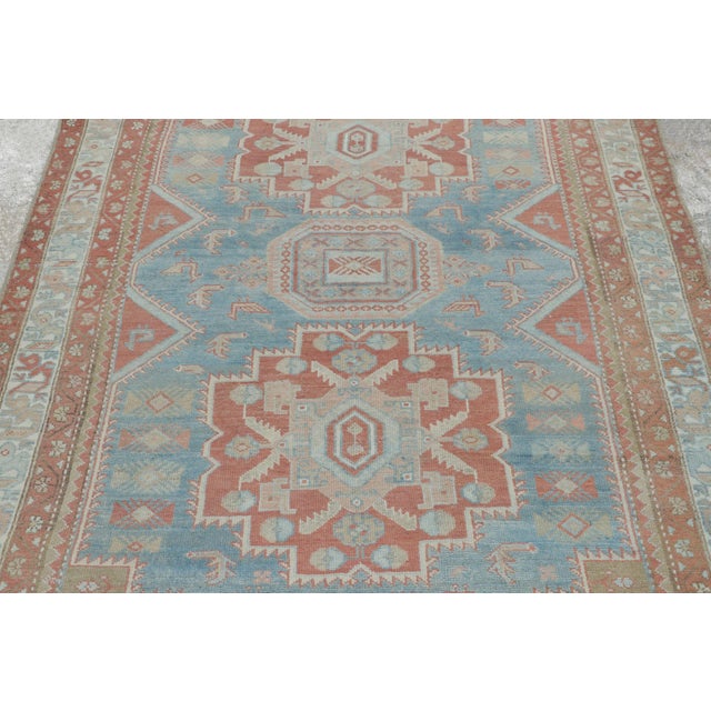 Hand-knotted in wool, this 4x7 antique Persian rug of Heriz provenance, circa 1880-1890, is a charming and collectible...
