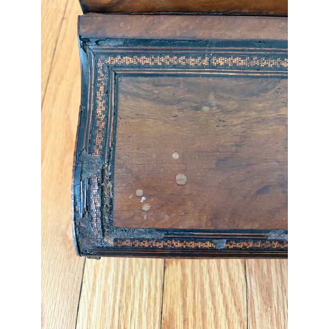 Antique French wood marquetry travel desk. One section with slots for writing implements and the other folds out to write...