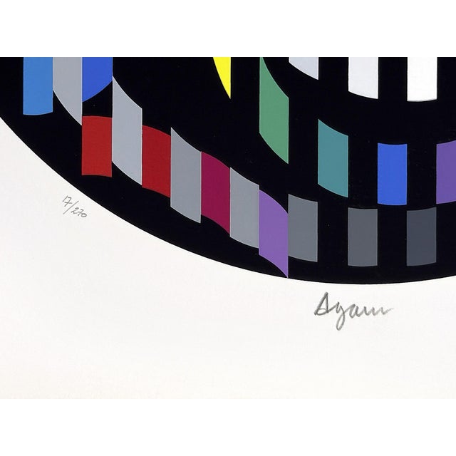 Serigraph on arches paper from Message of Peace portfolio. Hand signed lower front by Yaacov Agam. Hand numbered 17/270...