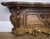 A beautifully crafted Vintage French coat hanger featuring rich oak tones and intricate carved detailing across the front...