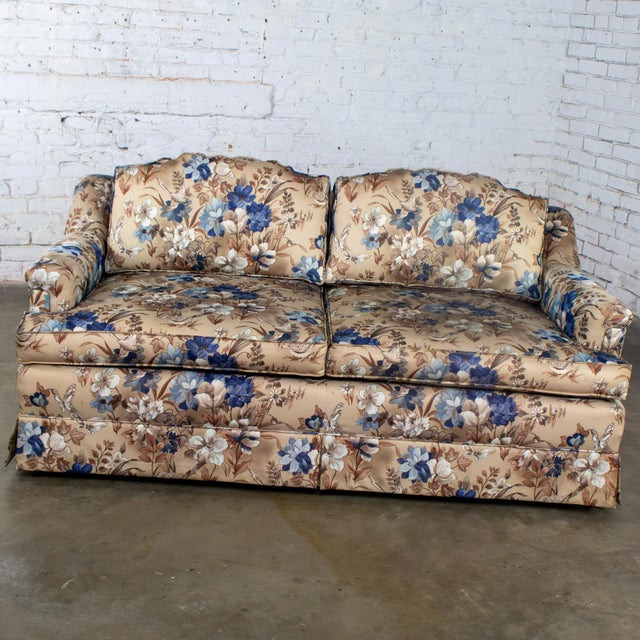 Marvelous vintage Traditional style small sofa or loveseat composed of front brass ball casters, round tapered wood back...
