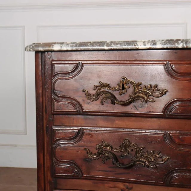 Exceptional 18th C French fruitwood serpentine three drawer commode with a wonderful 1.25" thick marble top. 1780. This...