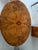 A striking 19th-century English Victorian tilt-top center table, circa 1850, crafted in beautifully figured burr walnut...