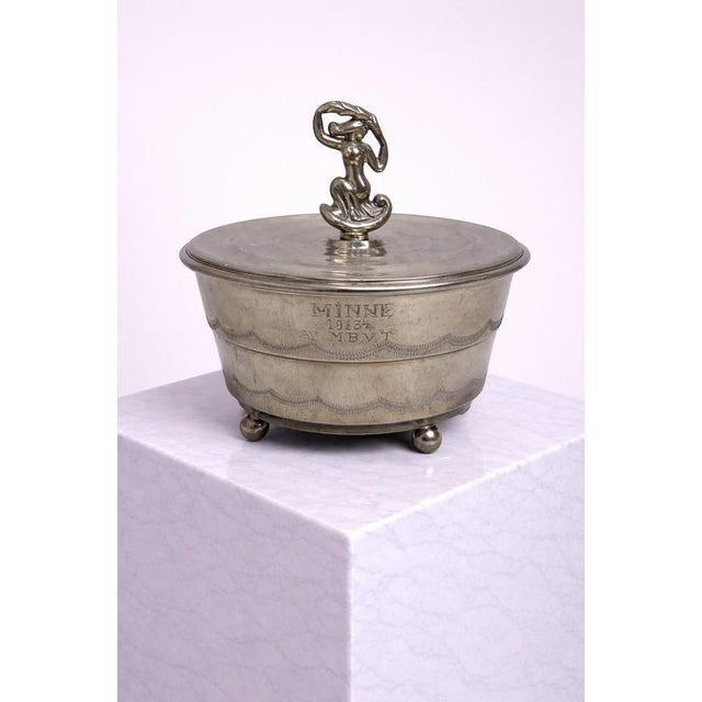 A rare and elegant swedish art deco pewter lidded box designed by sylvia stave for cg hallberg, dated 1928. This refined...