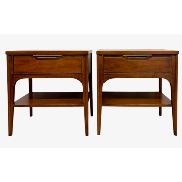 This matching pair of Mid-Century Modern end tables is from the Kent Coffey Impact Collection, a line known for its...