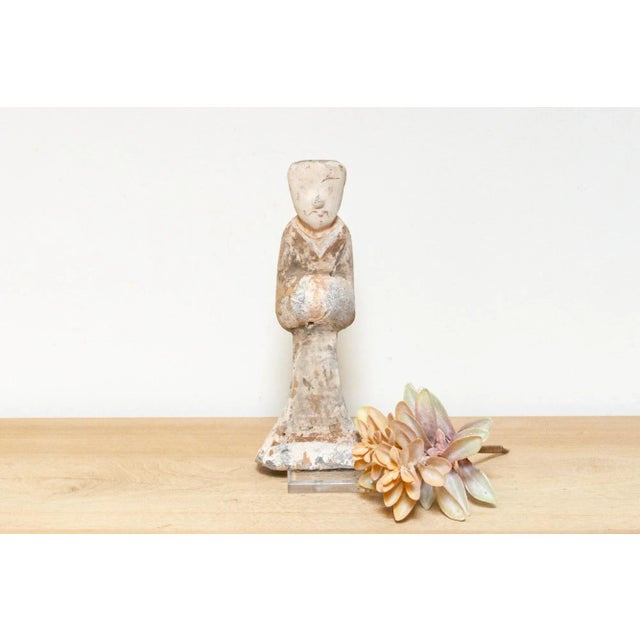 This beautiful old pottery statue crafted in the elegant style of the Han Dynasty, is a delightful representation of...