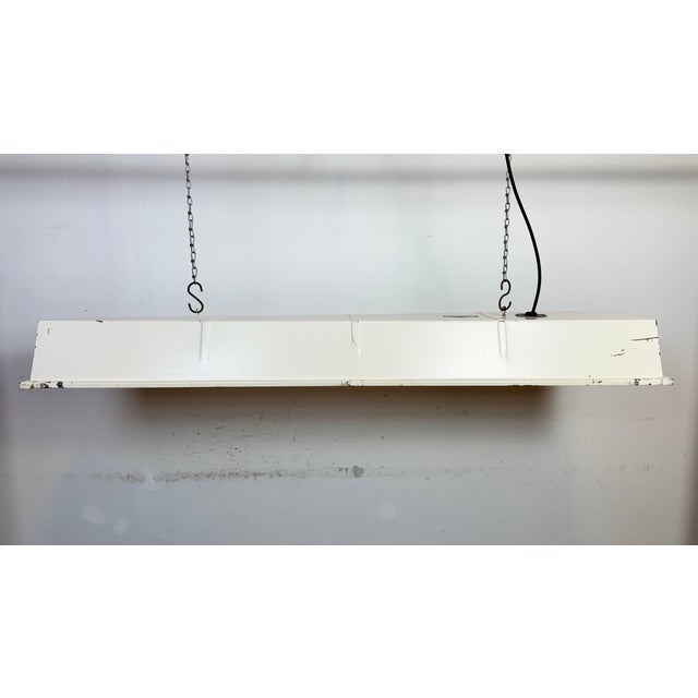 This beige iron industrial tube light was made by Famor in Poland during the 1970s .The light is converted into two Led...