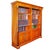 Empire-style cherry bookcase, open front with various compartments and four doors underneath, decorated with gilded and...