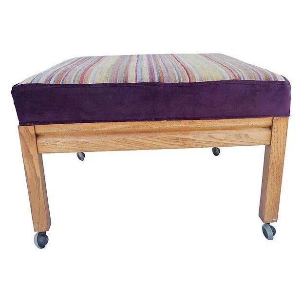 Midcentury oak ottoman with wheel casters, newly upholstered with Turkish striped wool kilim and contemporary purple color...
