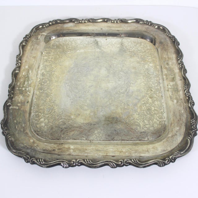Vintage square silver plated tray with a detailed edge and an embossed or engraved base. In well loved vintage condition...