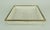 A 1950s tray in a minimalist, purist design. Made of white lacquered perforated metal with a brass rim. The design is...