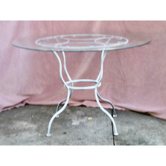 Vintage Patio Table and 4 Chairs Set. The Glass top Table is 45 inch in diameter and 29 inch high. Each chair is 36.5 inch...