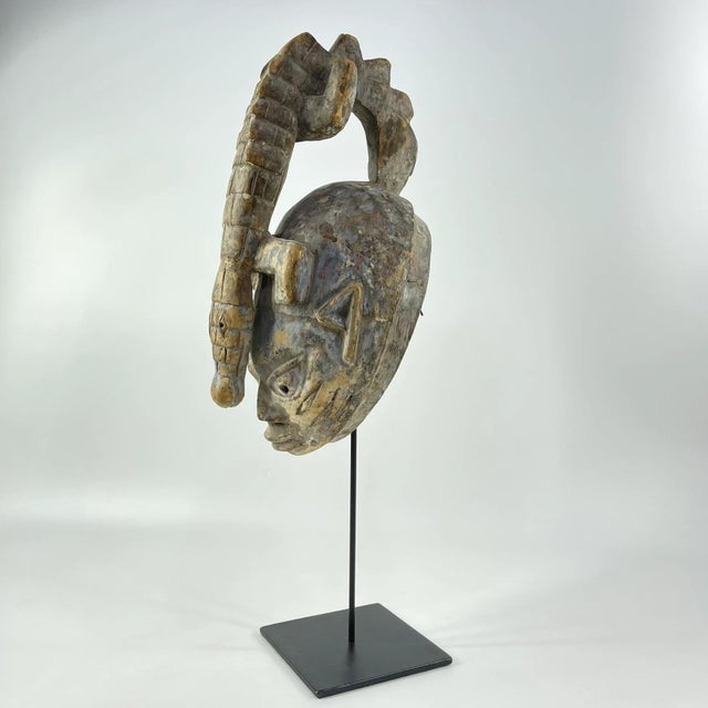The Gelede mask, originating from the Yoruba people living along the southwestern Nigerian and Beninese border, showcases...