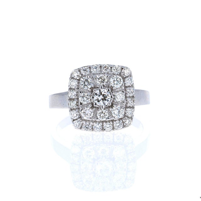 This ring has a cluster of Round Cut Brilliant Diamonds that weigh 1.14 Carats. The Clarity and Color of the Diamonds are...