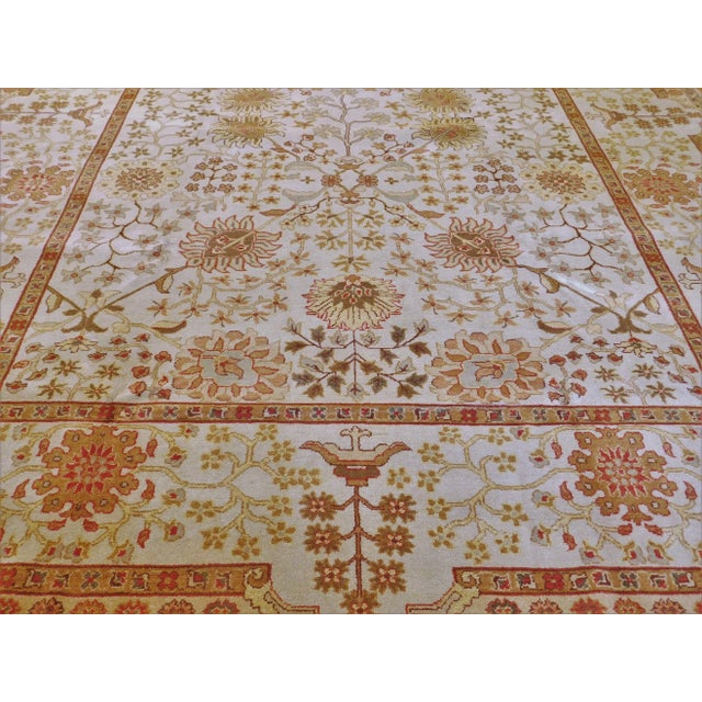 Genuine handmade wool pile rug. Stylized flower on a beige field. 9'2"x 12'