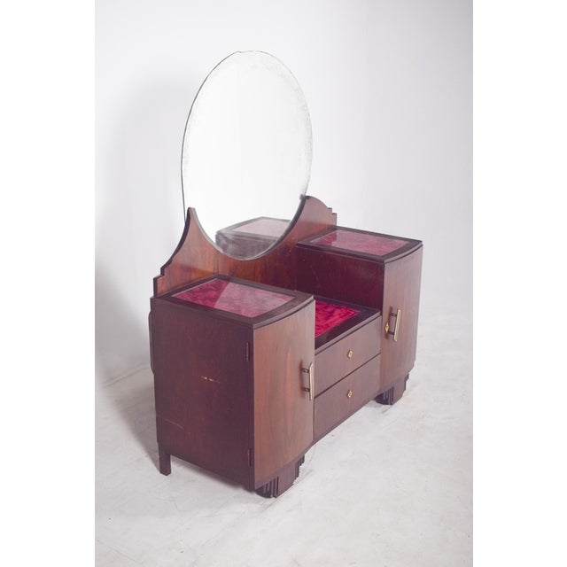 Dressing table with Art Deco mirror. Made from fine wood, it has straight, symmetrical lines typical of the style, with...