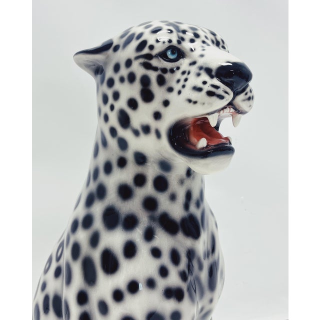 Unique handmade statue of a white leopard. This Hollywood Regency statue, crafted from hand-painted ceramic and made in...