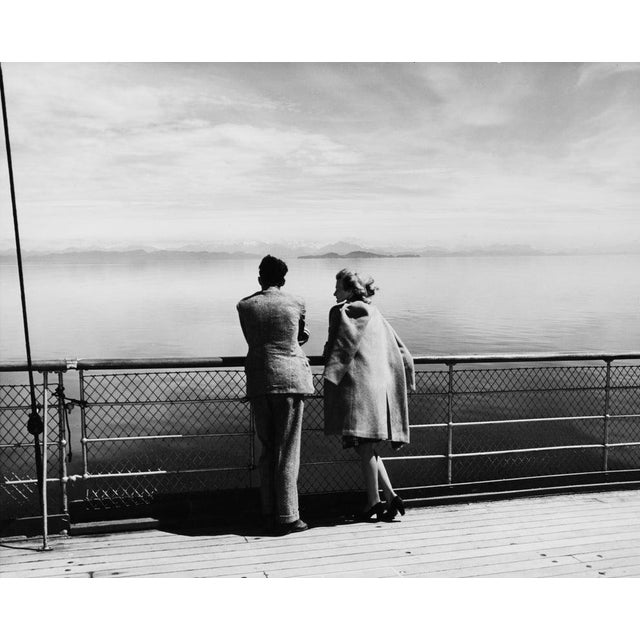 Queen Charlotte Strait A couple looking out over Queen Charlotte Strait from the deck of a ship, Canada, circa 1945....