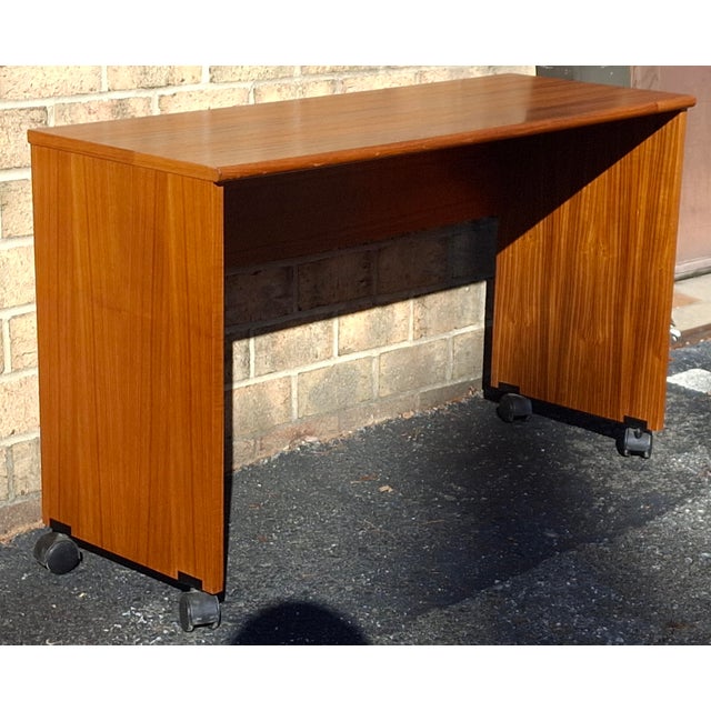 Scandinavian Danish Modern Teak Rolling Desk with removable wheels. Measures 42" in width, 16" in depth and 26" in height....