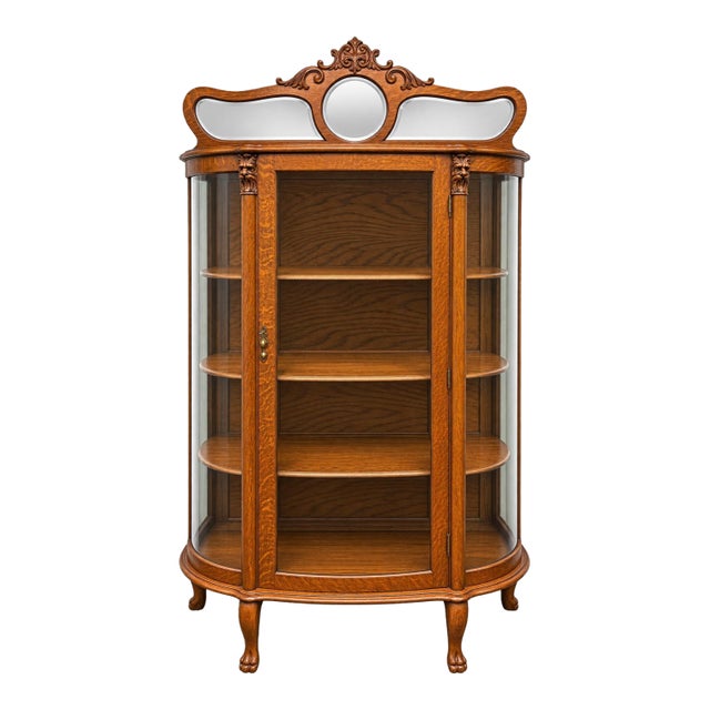 Antique Tiger Oak Curved-Glass China Cabinet With Carved Lion Motifs & Mirrored Crown For Sale