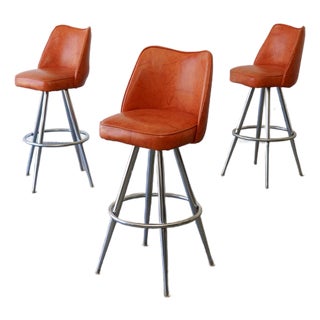 1970s Mid-Century Modern Orange Vinyl & Chrome Swivel Bar Stools — Set of 3 For Sale