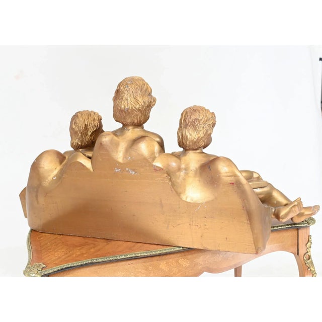 You are viewing a gorgeous trio of hand carved Italian cherubs Carved wood finished in gold gilt colour The cherub reading...