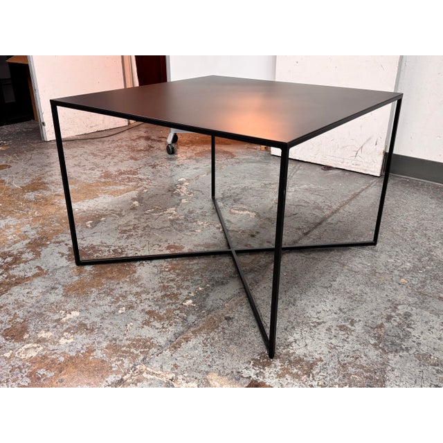 Design Plus Gallery presents a Metal Dining Table from Caravane. The table showcases a modern, minimalist approach to form...