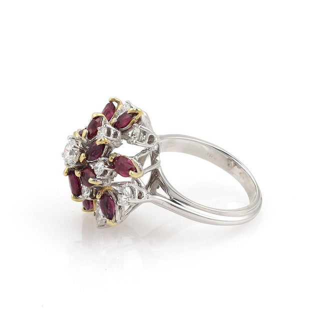 This is a magnificent yellow and white gold, diamonds and rubies ladies cluster ring. It is well crafted in solid 18k...