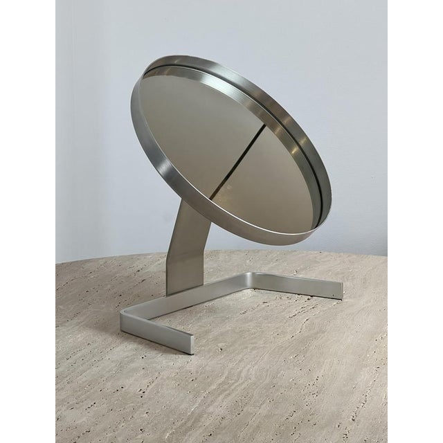 Circular mirror of the 70s by the French designer Pierre Vandel. This mirror dates from the start of his career as a...