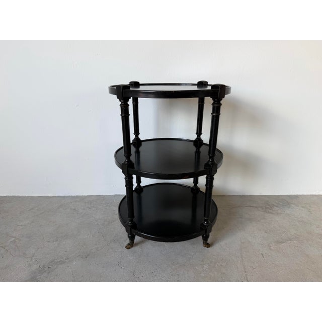 Hollywood Regency 1960s Hollywood Regency Black Ebonized Three-Tier Side Table on Brass Casters For Sale - Image 3 of 12